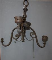 An Art Nouveau brass three branch chandelier