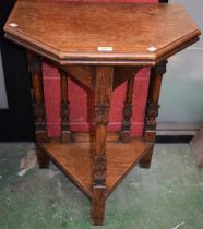 An early 20th century oak credence type table, hinged moulded top opening for convenience,