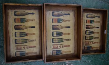 A contemporary nest of three graduated serving trays