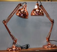 A pair of copper coloured Anglepoise type desk lamps (2)