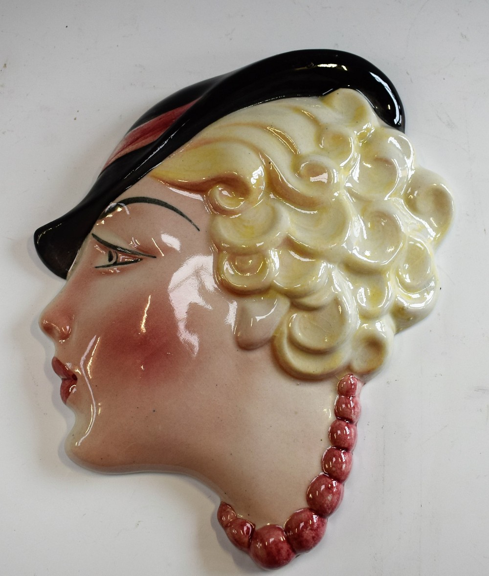 An Art Deco Staffordshire wall mask,