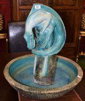 A large ceramic dragon water feature, turquoise glaze, approx 58cm diameter,