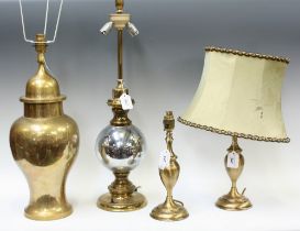 A large brass baluster table lamp; a similar pair smaller;