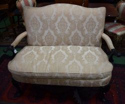 A George II style ebonised reception sofa, shaped back,