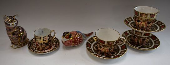 A set of three Royal Crown Derby 1128 pattern tea cups and saucers,