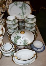 A Japanese Maruni China part dinner service, decorated with bamboo on white ground, gilt band,