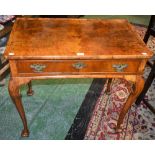 A George II Revival walnut silver table, dished rectangular top above a long frieze drawer,