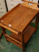 A vintage mid-20th century design oak serving trolley