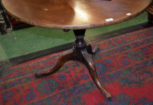 A large George III mahogany tripod occasional table, circular top,