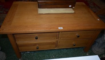 An oak coffee table/cabinet,