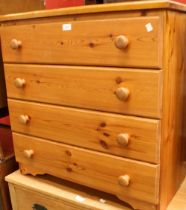 A pine chest of four long drawers