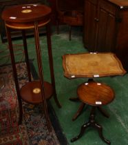 An Edwardian inspired two tier jardiniere stand; a George III style wine table,