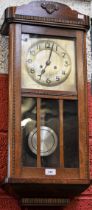 A early-mid 20th century oak cased wall clock