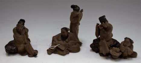 A set of three stoneware Chinese figure groups,