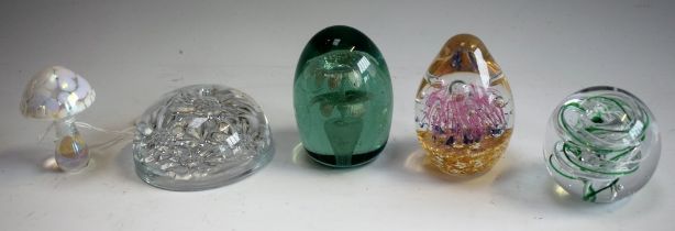 Paperweights - a Victorian green glass dump paperweight double floral inclusion; others, Langham,