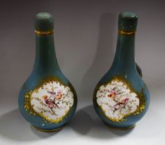 A pair of English porcelain Sèvres style bottle vases and covers,
