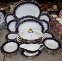 A Royal Doulton Imperial Blue pattern part dinner service, comprising dinner plates, salad plates,