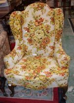 A George III design wingback reception armchair, scroll arms,