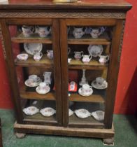 A late 19th century oak pier display cabinet,