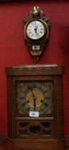 A mahogany brass mounted wall clock, enamel dial, Roman numerals, striking on a bell, shield mount,