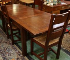 A contemporary oak extending dinning table,