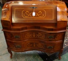 A Dutch style marquetry inlaid bureau, shaped top with fall front, fitted interior,