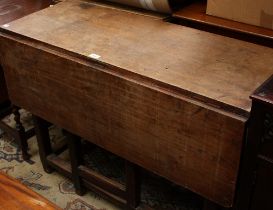 A 19th century Farmhouse pine gateleg table, drawers to frieze,