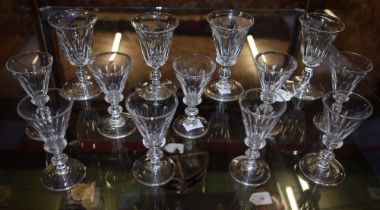 A set of four 19th century fortified wine glasses, faceted trumpet-shaped bowls, knop stem,