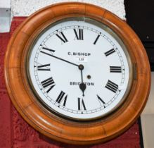 An oak cased railway/school type wall clock, C Bishop, Brighton,