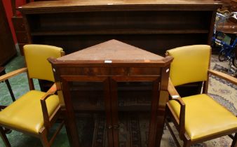 An oak open bookcase; a pair of early-mid 20th century office chairs;