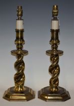 A pair of brass table lamps, spiral columns,