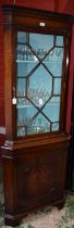 A George III revival mahogany corner display cabinet,