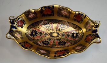 A Royal Crown Derby 1128 Old Imari pattern solid gold band footed oval trinket dish