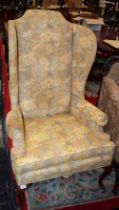 A George III design wingback reception armchair, scroll arm,