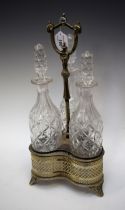 A Victorian plated trefoil decanter stand, with three cut glass decanters,