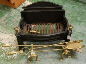 A cast iron fire grate; a pair of brass fire dogs; shovel;