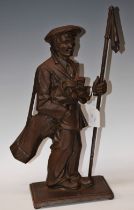 A fireside companion, as a golfer's caddy, carrying his clubs and holding a flagstick marker,