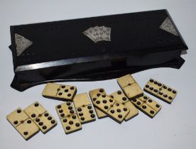An Edwardian silver mounted ebony games box,