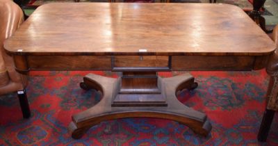 A George/William IV rosewood library table, rounded rectangular top above a frieze drawer,
