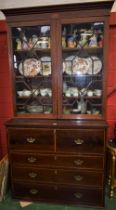 A George III satinwood crossbanded mahogany secretaire bookcase,