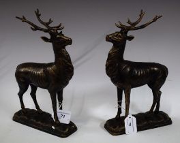 A pair of reproduction cast metal models, as stags,