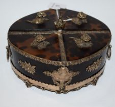 A Victorian silver coloured metal and tortoiseshell oval box, divided into quarters, flower handles,