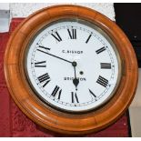 An oak cased railway/school type wall clock, C Bishop, Brighton,