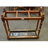 A Victorian oak stick stand, turned supports,