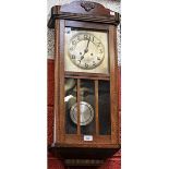 A early-mid 20th century oak cased wall clock