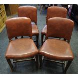 A set of four mid 20th century oak dining chairs, Leatherette backs and seats, c.