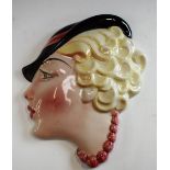 An Art Deco Staffordshire wall mask,