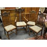 A set of late 19th Century Carolean style oak dining chairs, carved and pierced toprail,