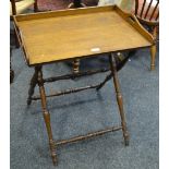 An early 20th Century oak butler's tray and folding stand