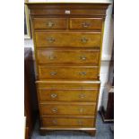 A reproduction burr walnut and mahogany chest on chest, two small drawers over three long to top,
